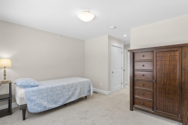 bedroom featuring recessed lighting, light colored carpet, and baseboards