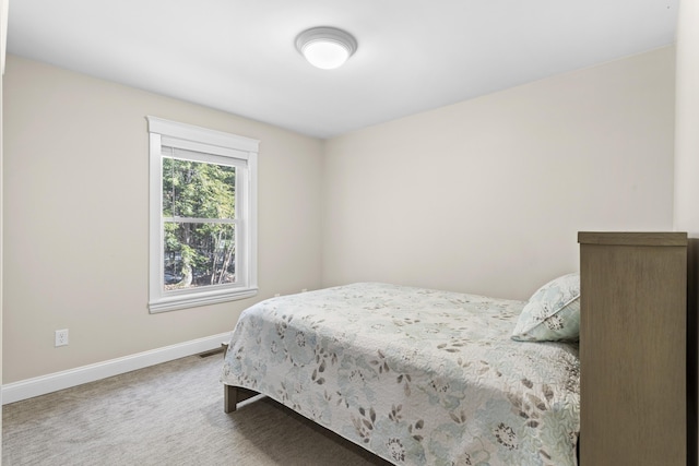 bedroom featuring visible vents, baseboards, and carpet flooring