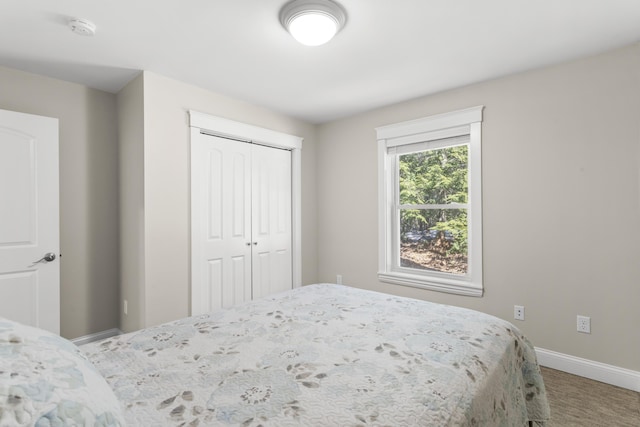 unfurnished bedroom featuring a closet and baseboards