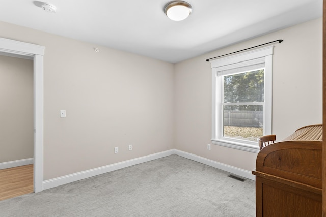 bedroom with light colored carpet, baseboards, and visible vents