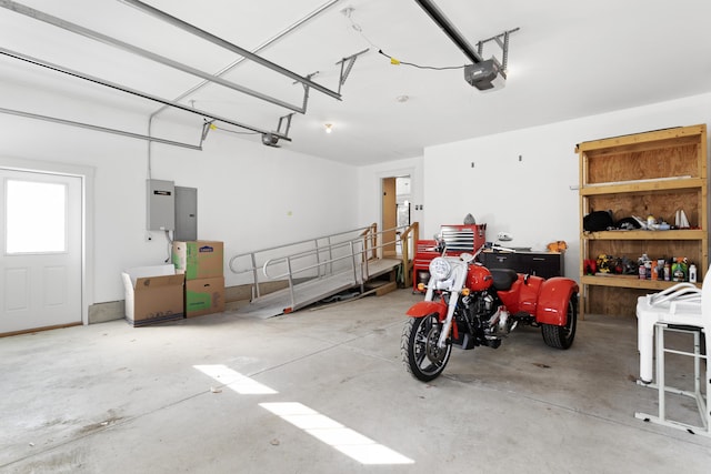 garage with electric panel and a garage door opener