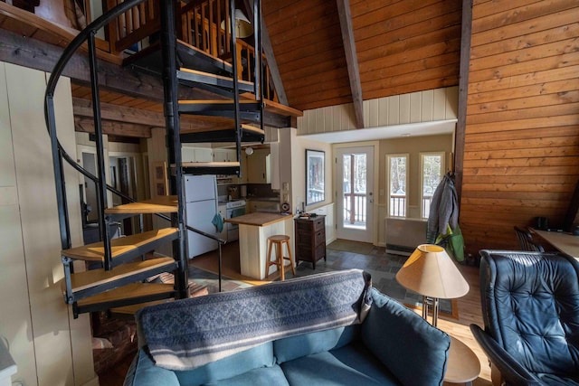 living room with wood ceiling, stairway, beamed ceiling, wood walls, and high vaulted ceiling