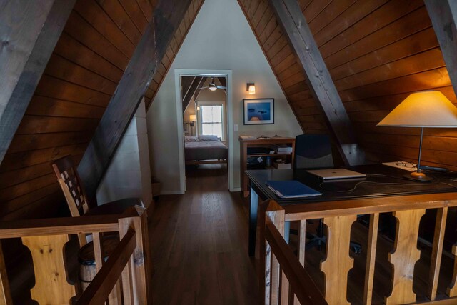 interior space with wood ceiling, vaulted ceiling with beams, and wood finished floors