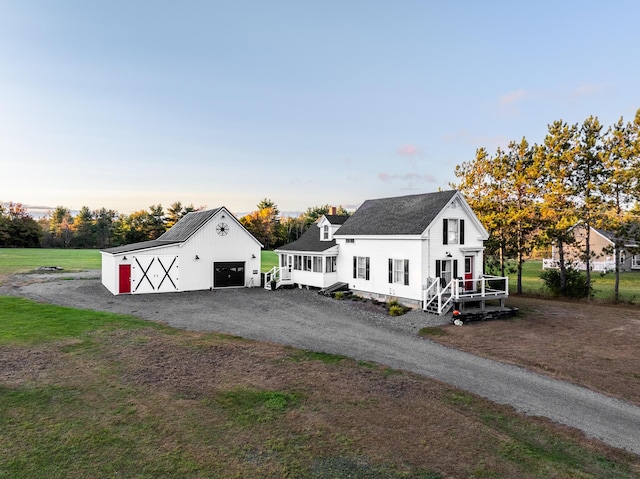 exterior space with an outbuilding and a garage