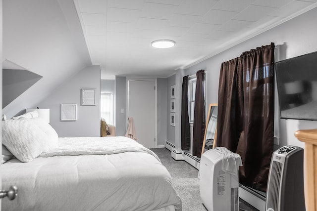 bedroom with carpet and a baseboard radiator