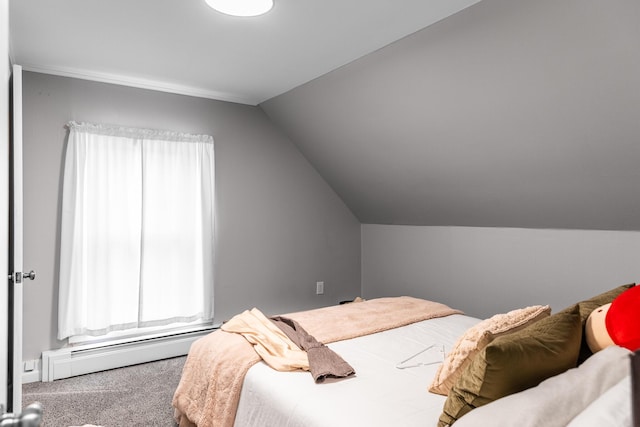 carpeted bedroom with lofted ceiling and a baseboard radiator