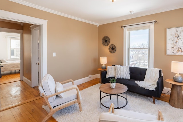 living room featuring ornamental molding, plenty of natural light, and hardwood / wood-style flooring