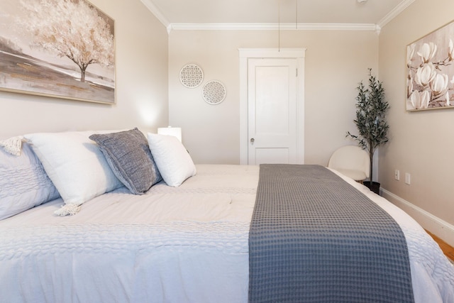 bedroom featuring baseboards and ornamental molding