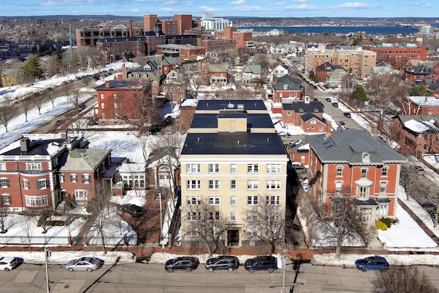 snowy aerial view featuring a residential view