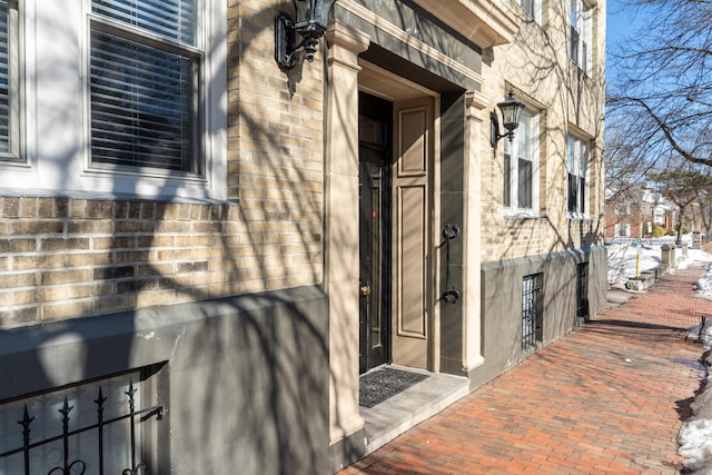 doorway to property with stone siding