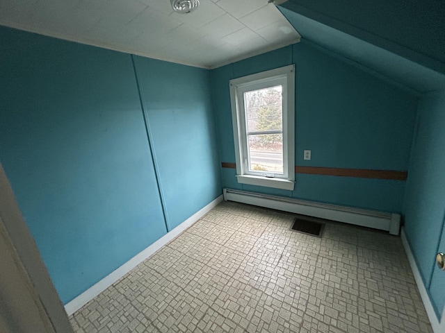 bonus room with lofted ceiling, visible vents, a baseboard heating unit, and baseboards