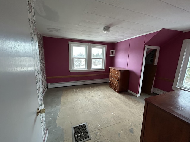 unfurnished bedroom featuring a baseboard radiator and visible vents