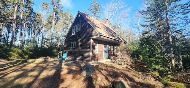 view of home's exterior featuring a chimney