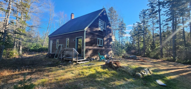 view of home's exterior with a chimney