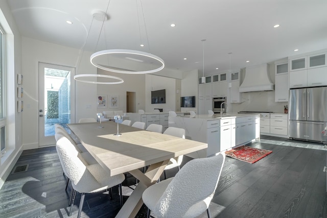 dining room with dark wood-type flooring, recessed lighting, and visible vents