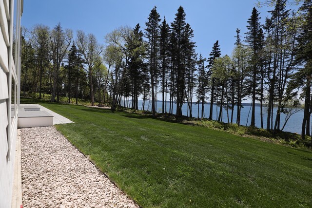 101 Cow Pt, Roque Bluffs, ME 04654 - view of green lawn featuring a water view