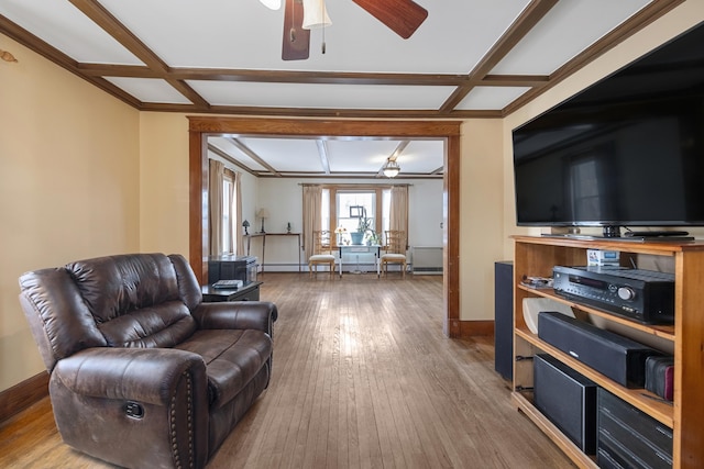 living area with hardwood / wood-style floors, coffered ceiling, and baseboards