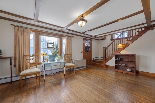 living area featuring baseboards, radiator heating unit, wood-type flooring, stairs, and baseboard heating