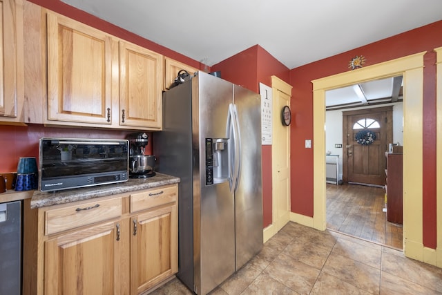 kitchen with wine cooler, light tile patterned flooring, a toaster, baseboards, and stainless steel fridge with ice dispenser