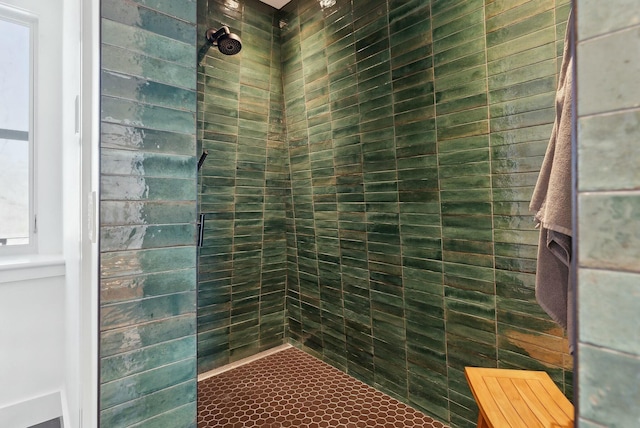 bathroom with a tile shower