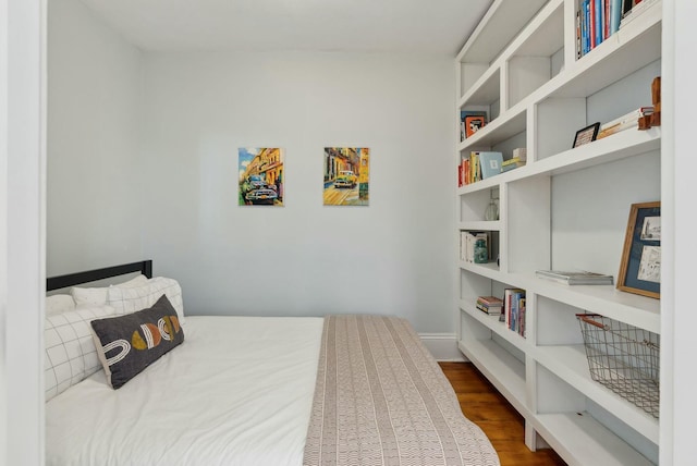 bedroom with wood finished floors