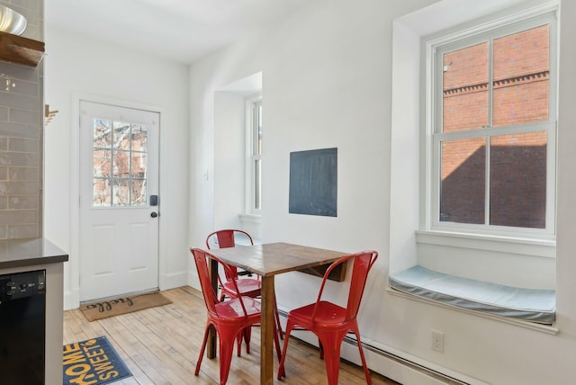 dining area featuring light wood-style floors