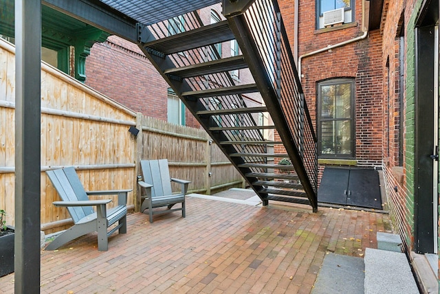 view of patio / terrace featuring fence