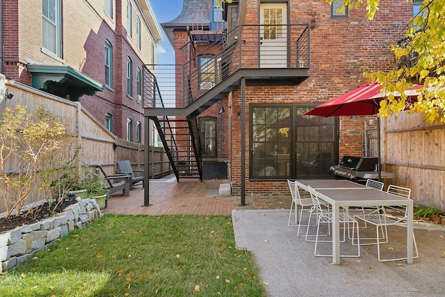 view of patio / terrace with a fenced backyard and area for grilling