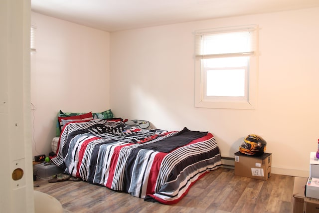 bedroom featuring wood finished floors