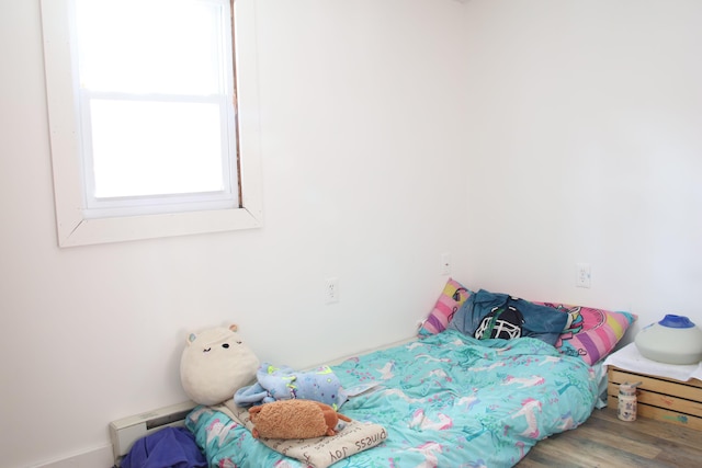 bedroom with wood finished floors