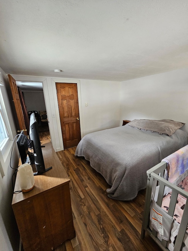 bedroom with wood finished floors