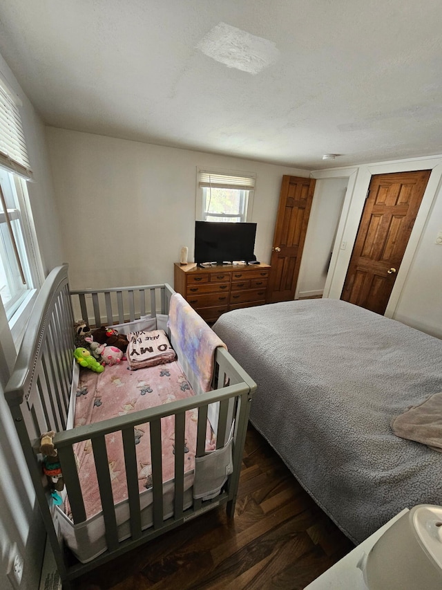 bedroom with wood finished floors