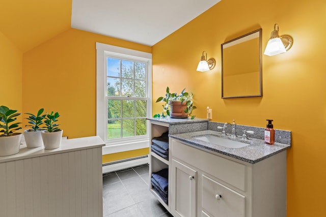323 Runaround Pond Rd, Durham, ME 04222 - bathroom featuring baseboard heating, vanity, lofted ceiling, and tile patterned flooring