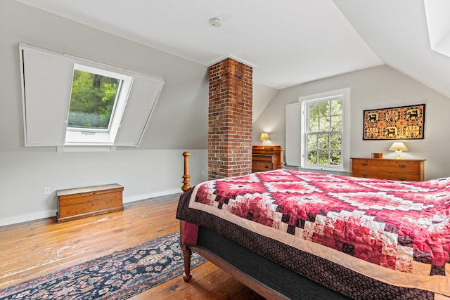 323 Runaround Pond Rd, Durham, ME 04222 - bedroom with hardwood / wood-style flooring, lofted ceiling, and baseboards