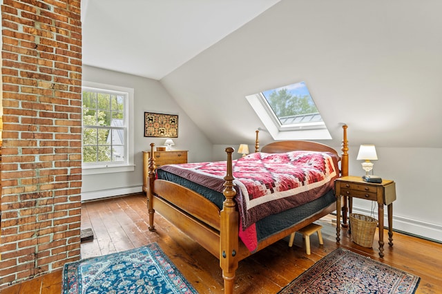 323 Runaround Pond Rd, Durham, ME 04222 - bedroom featuring a baseboard radiator, lofted ceiling, wood-type flooring, a skylight, and baseboards