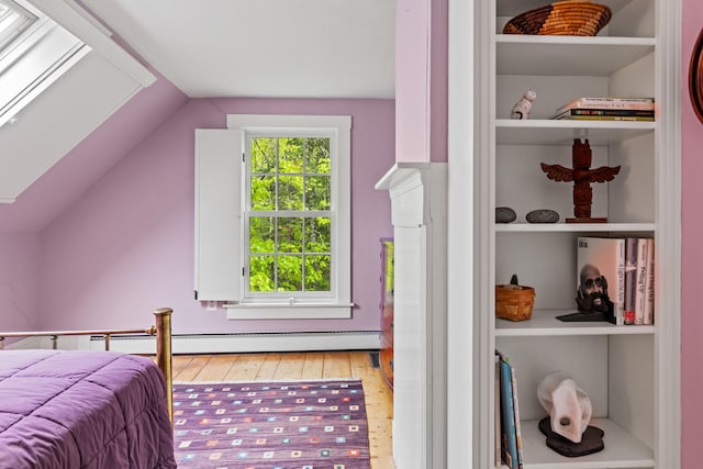 323 Runaround Pond Rd, Durham, ME 04222 - bedroom featuring wood-type flooring, lofted ceiling, and a skylight