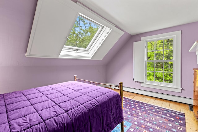 323 Runaround Pond Rd, Durham, ME 04222 - bedroom featuring light wood-type flooring, lofted ceiling, and a skylight