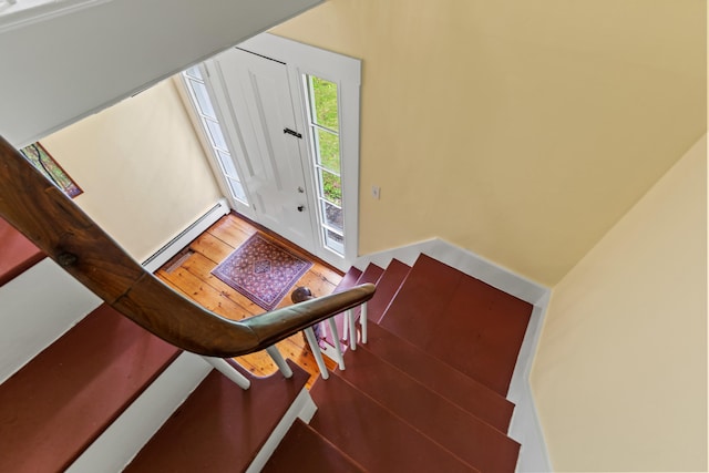 323 Runaround Pond Rd, Durham, ME 04222 - stairs with a baseboard radiator and wood finished floors