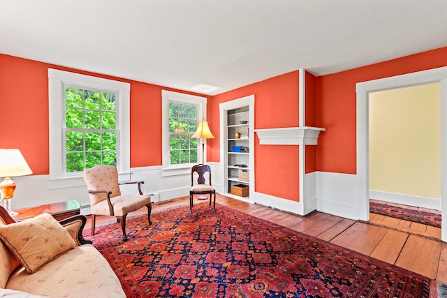 323 Runaround Pond Rd, Durham, ME 04222 - sitting room featuring hardwood / wood-style floors and a baseboard heating unit