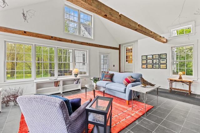 323 Runaround Pond Rd, Durham, ME 04222 - living area featuring high vaulted ceiling, dark tile patterned flooring, plenty of natural light, and beamed ceiling