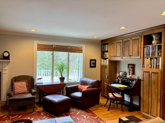 living area featuring recessed lighting, a fireplace, light wood-type flooring, and ornamental molding