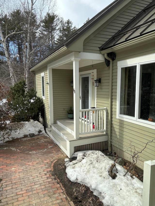 doorway to property featuring a porch