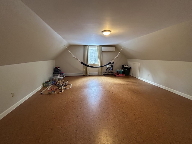 bonus room with a baseboard heating unit, baseboards, an AC wall unit, and vaulted ceiling