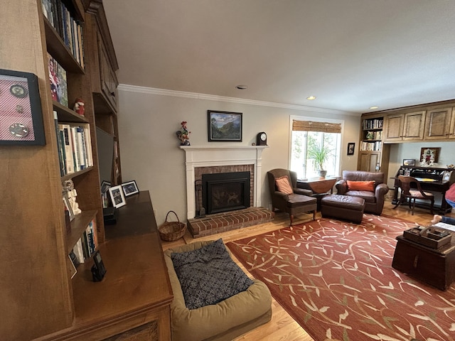 living area featuring a fireplace, crown molding, recessed lighting, and wood finished floors