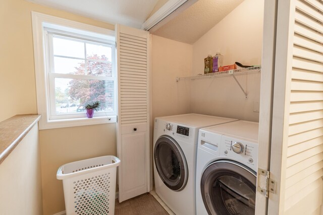 laundry room with laundry area and washer and clothes dryer