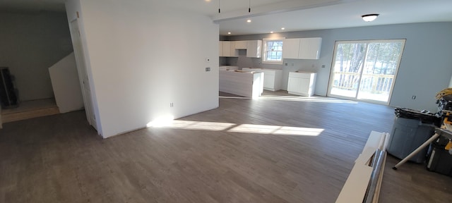 unfurnished living room with recessed lighting and wood finished floors