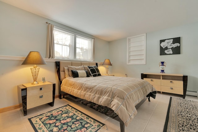 bedroom with light tile patterned floors, a baseboard radiator, and baseboards