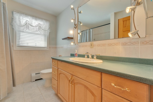 full bathroom with tile patterned flooring, toilet, vanity, baseboard heating, and tile walls