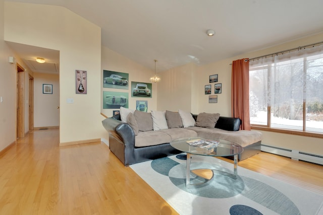 living room with baseboards, lofted ceiling, light wood-type flooring, baseboard heating, and a chandelier