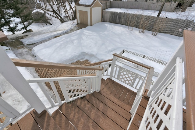 exterior space with a storage shed, an outdoor structure, and fence